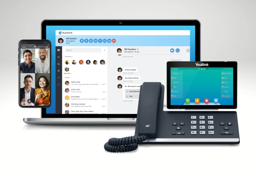 A modern VoIP communication setup featuring a laptop with a messaging app, a smartphone displaying a video call, and a Yealink desk phone with a touchscreen interface.